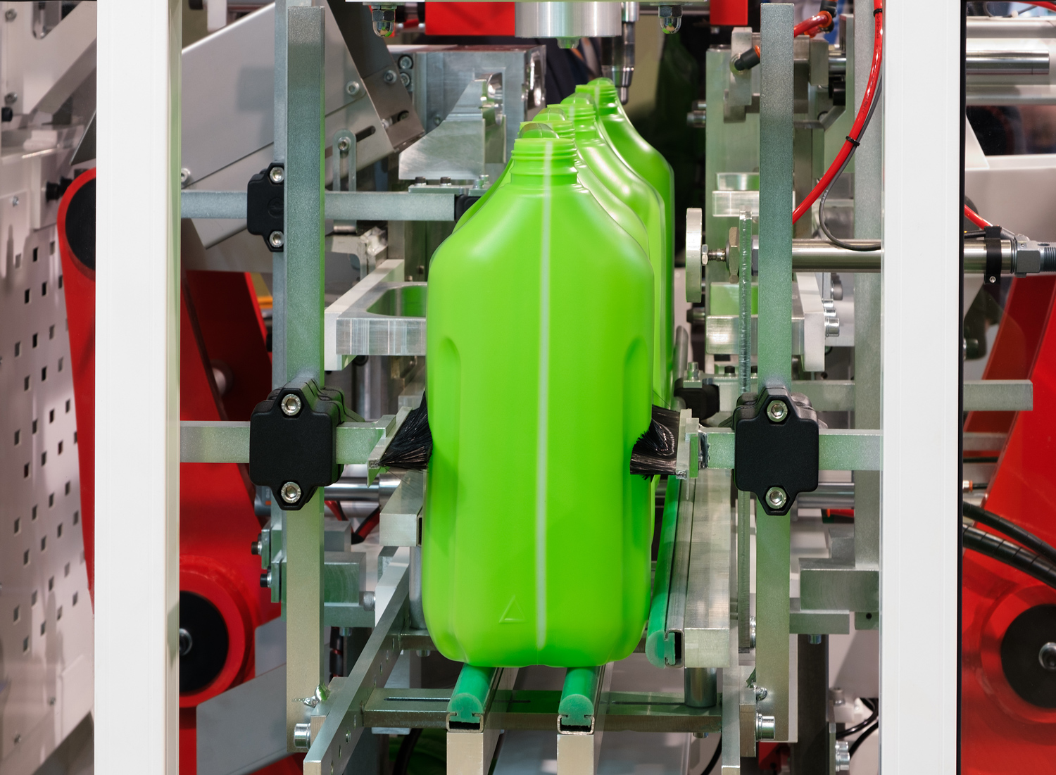 Finished plastic pipe coming off an extrusion line